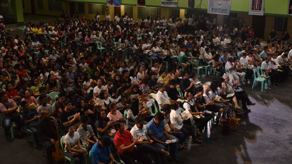 Cathedral of Faith showing God's love to many people in a gymnasium